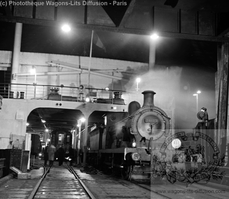 Wl the ferry boat from dover to dunkirk loaded with the night train carriages by a shunting locomotive 1953